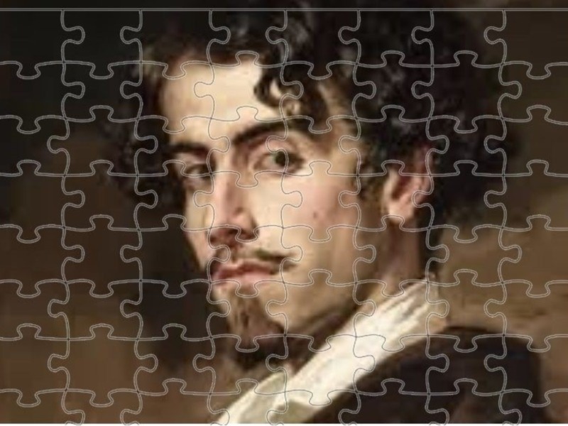 Un retrato de un joven con cabello oscuro y cejas prominentes, mirando directamente a la cámara. El fondo es de color marrón oscuro con detalles suaves y suaves, destacando la expresión serena del rostro.