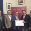 El Colegio de Administradores de Fincas de Sevilla entrega el talón del euro solidario a Cáritas Diocesana