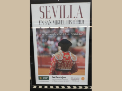 Poster anunciando un San Miguel Histórico en Sevilla, con información sobre la fecha y lugar.